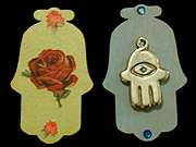 Two hamsas with a rose and a hamsa
